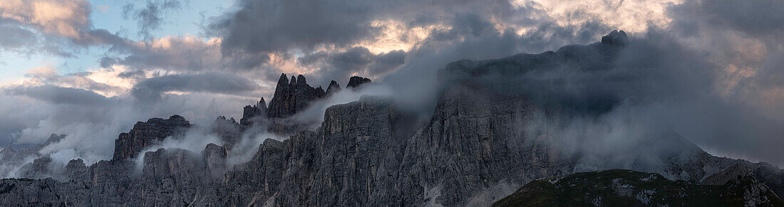 Panorama of a sunrise with low clouds in the Dolomites of Lastoni di Formin and Croda da Lago, Veneto, Italy, Europe