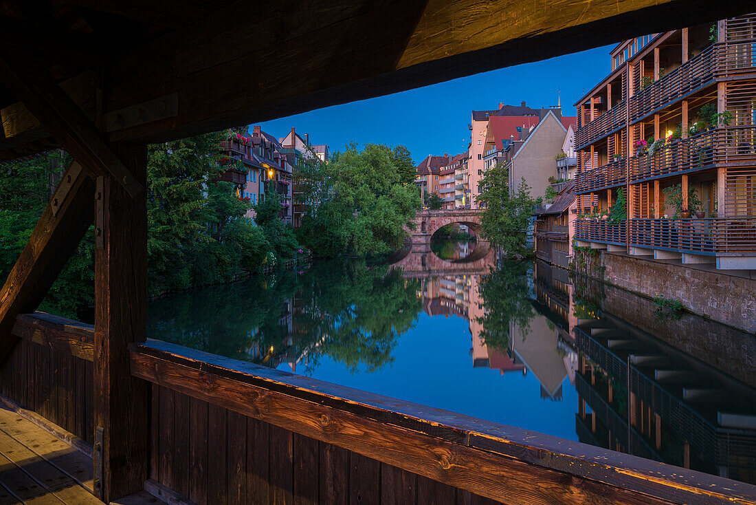 Residential buildings along Pegnitz River seen from wooden Henkersteg bridge, Nuremberg, Bavaria, Germany, Europe