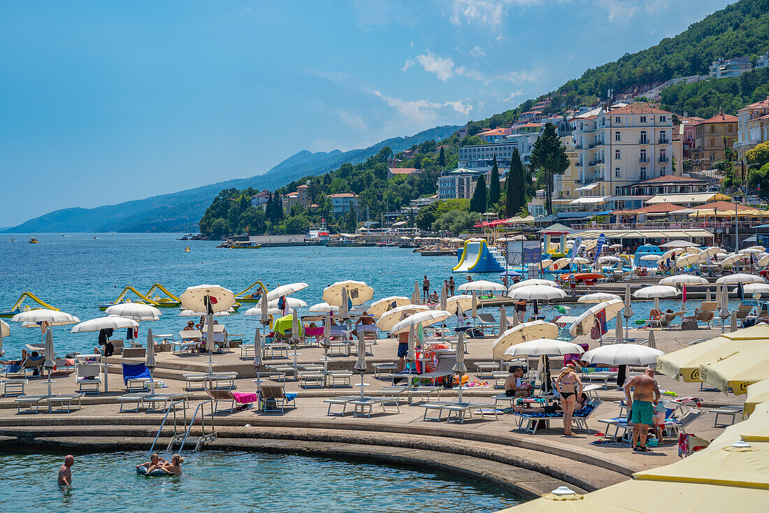 View of restaurants and sunshades on The Lungomare promenade in the town of Opatija, Opatija, Kvarner Bay, Croatia, Europe