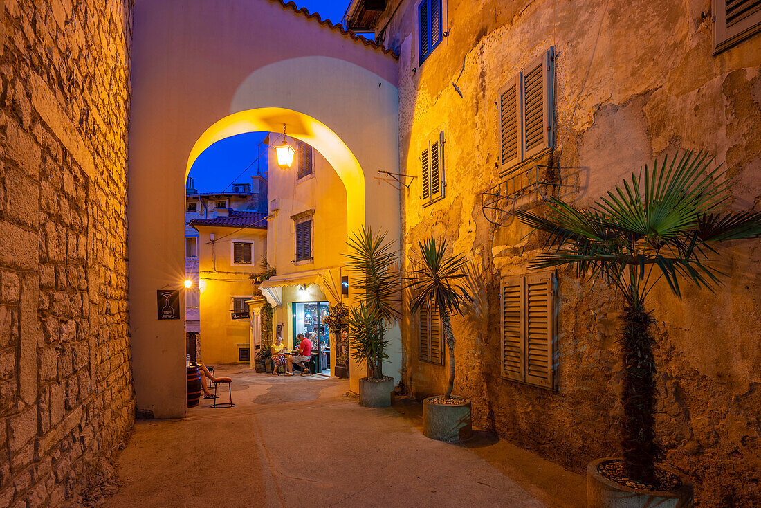 View of cafe bar at dusk, Lovran, Kvarner Bay, Eastern Istria, Croatia, Europe