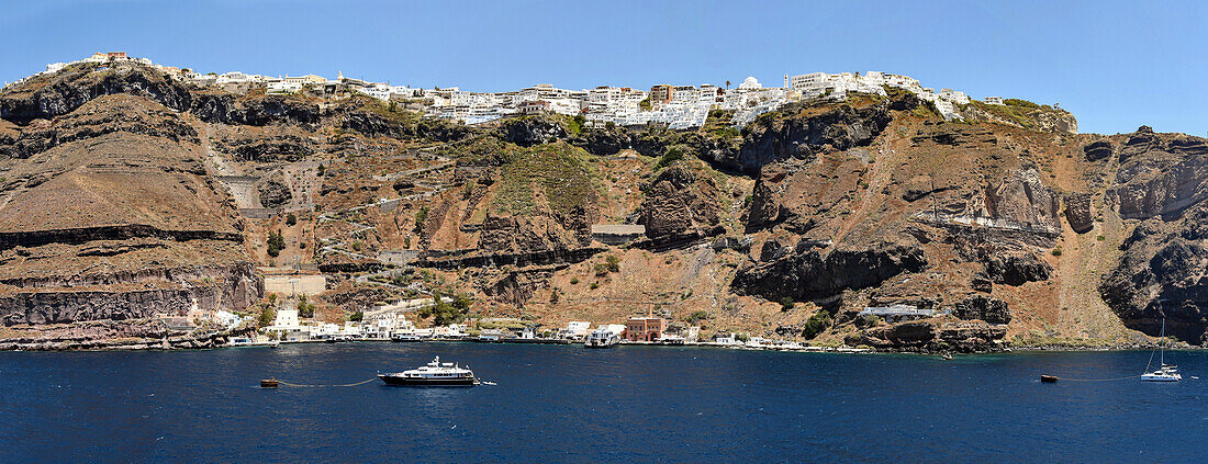 Wall of the Minoan caldera, with town of Thira (Fir) perched on rim, Santorini, Cyclades, Greek Islands, Greece, Europe