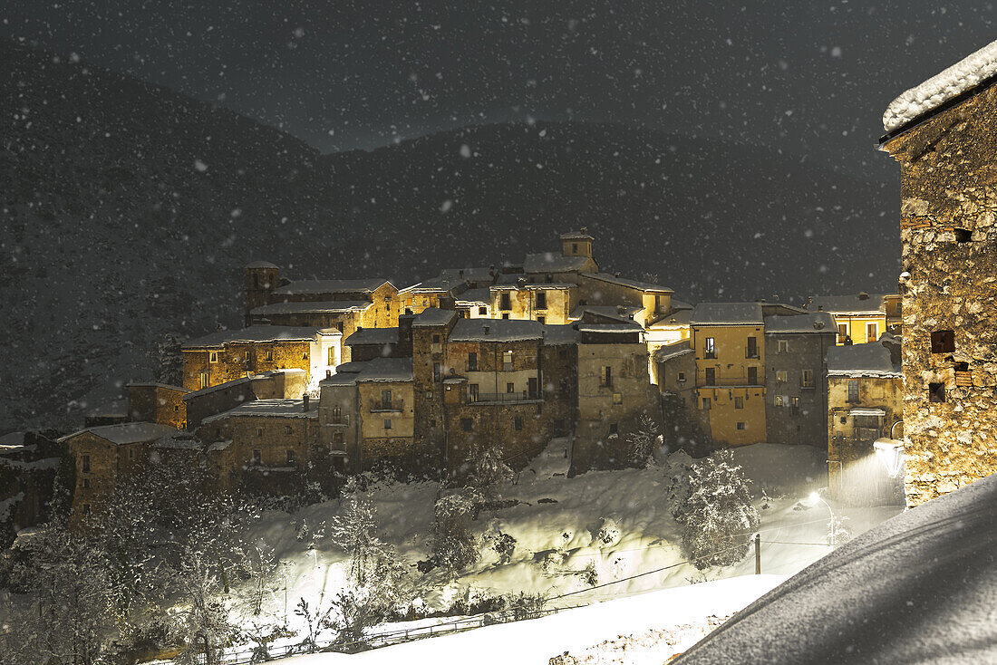 Winter view of the illuminated medieval village of Cansano during snowfall, Cansano, L'Aquila provice, Abruzzo, Italy, Europe