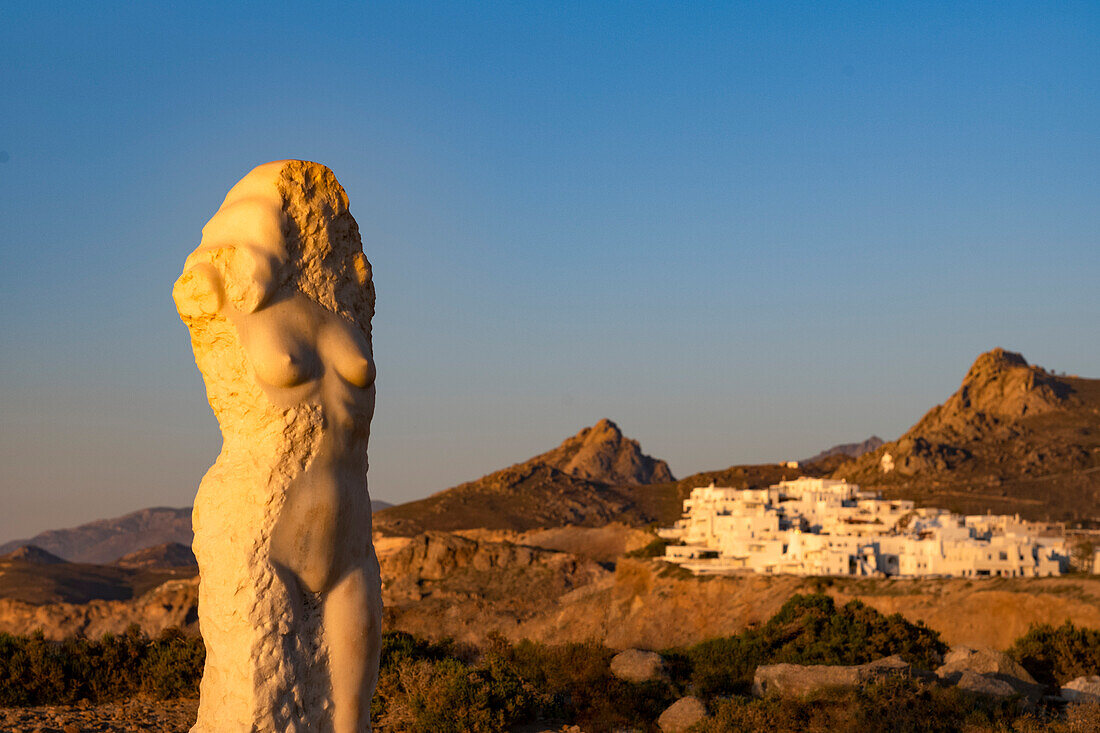 Sculpture of Ariadne on the causeway to Porta Gateway, bathed in warm evening light, Naxos Town, Naxos, the Cyclades, Aegean Sea, Greek Islands, Greece, Europe