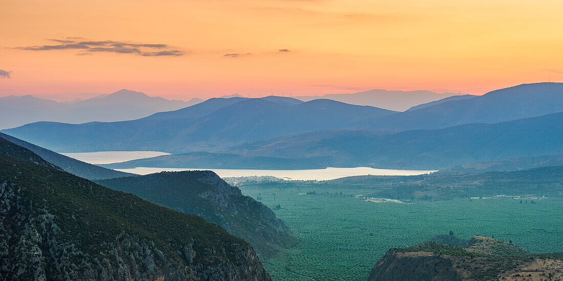 View over the Pleistos River Valley towards the Gulf of Corinth at dusk, Delphi, Phocis, Greece, Europe