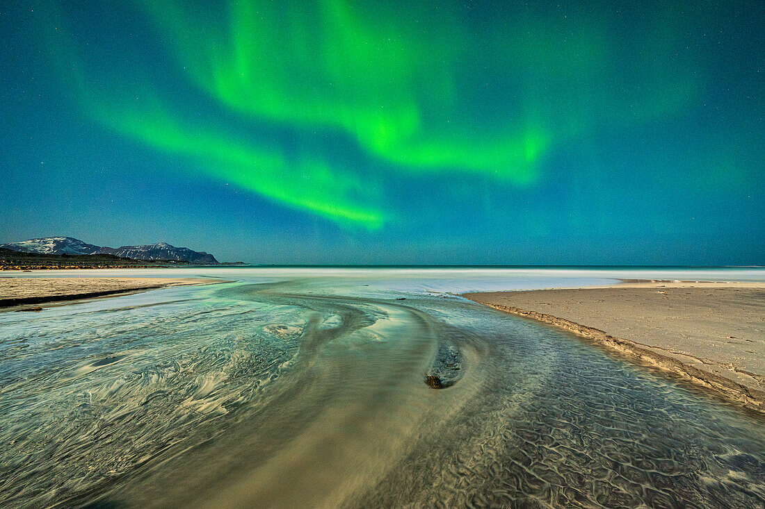 Rippled sand washed by waves during the Aurora Borealis (Northern Lights), Skagsanden beach, Ramberg, Nordland county, Lofoten Islands, Norway, Scandinavia, Europe