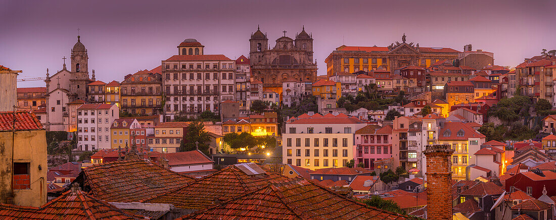 View of buildings and terracota rooftops of The Ribeira district at dusk, UNESCO World Heritage Site, Porto, Norte, Portugal, Europe