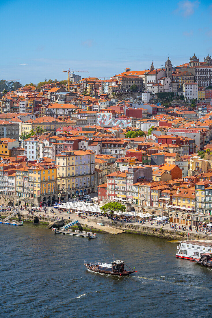 View of Douro River and terracota rooftops of The Ribeira district, UNESCO World Heritage Site, Porto, Norte, Portugal, Europe