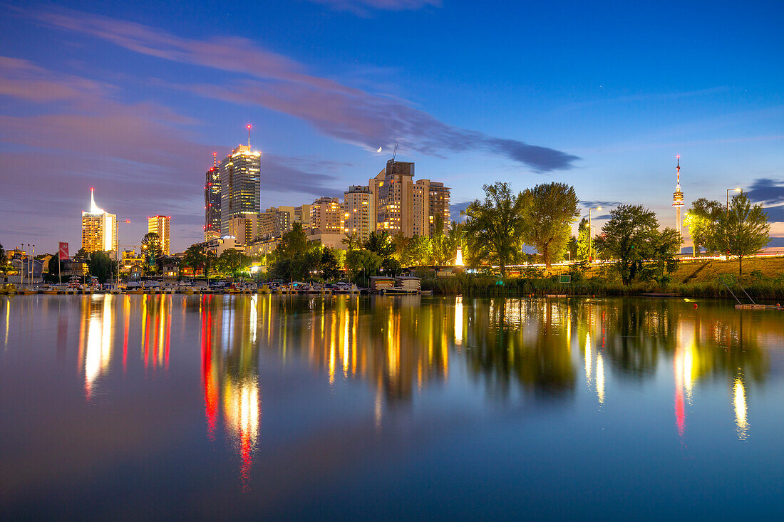 City Skyline at dusk, River Danube, Alte Donau, Vienna, Austria, Europe