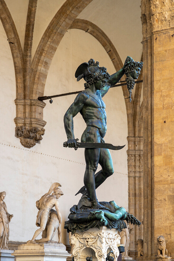 Perseus with the head of Medusa, a bronze sculpture by Benvenuto Cellini, Loggia dei Lanzi, Piazza della Signoria, Florence, Tuscany, Italy, Europe