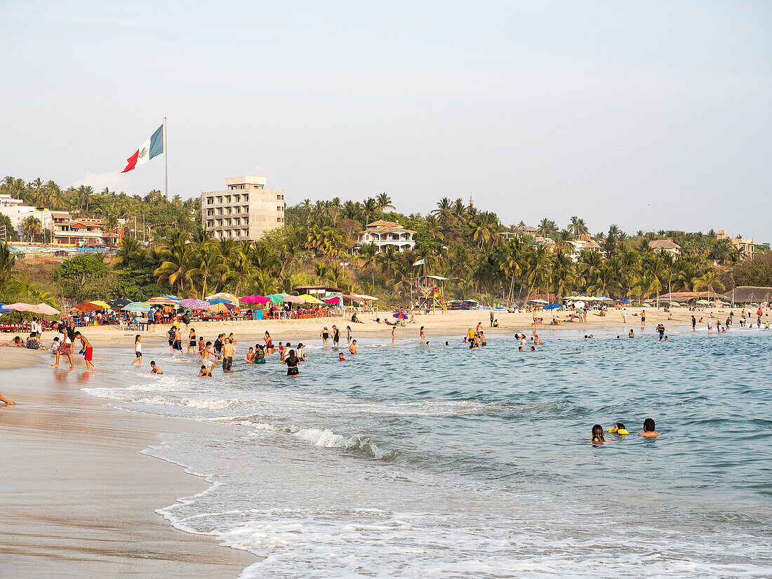 Playa Principal, the relatively calm beach at Puerto Escondido's small harbor, a favorite for swimming and eating seafood, Oaxaca, Mexico, North America