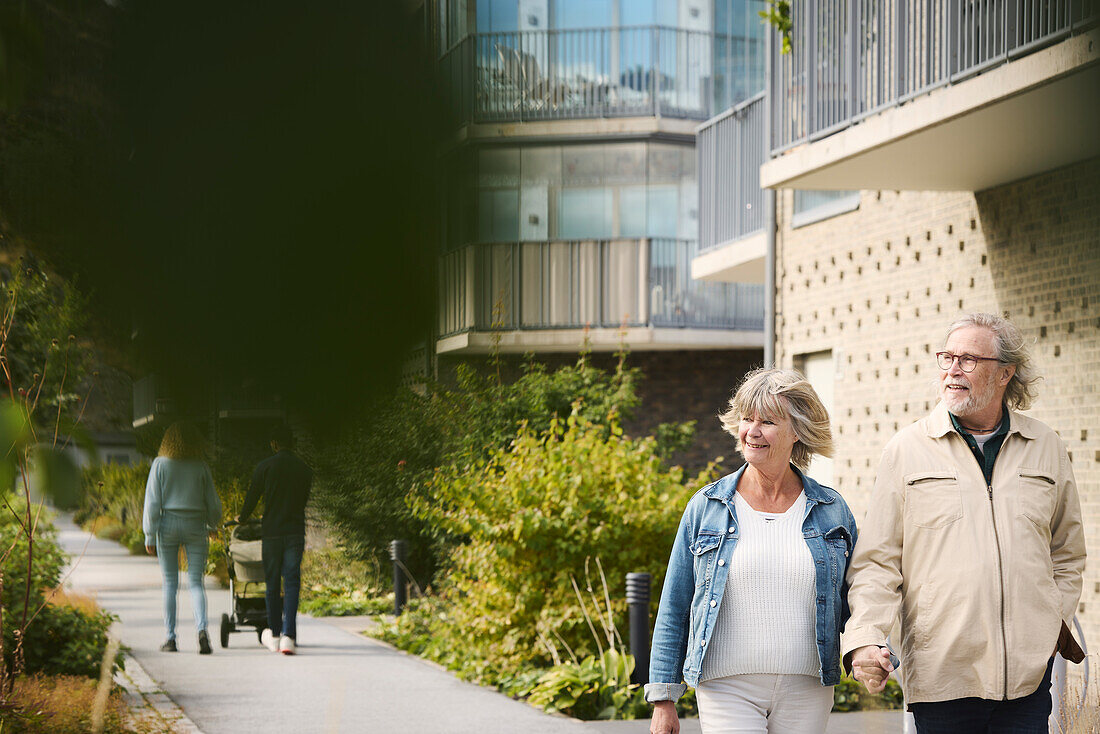 Senior couple walking in residential area