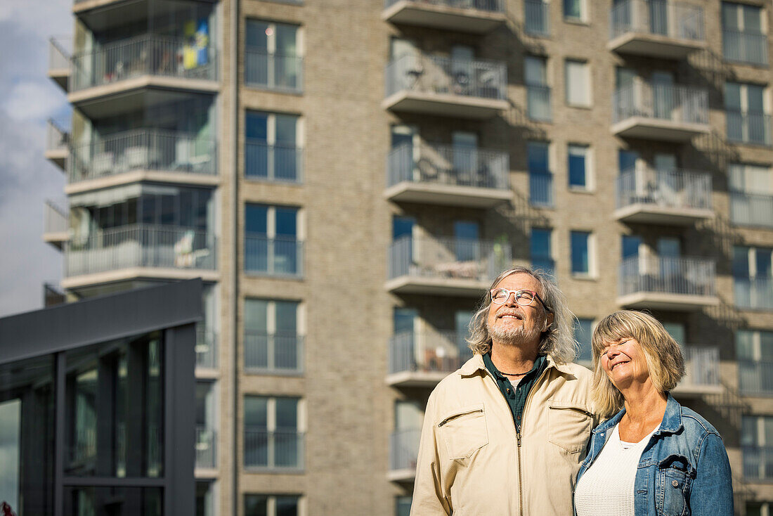 Smiling senior couple in residential area
