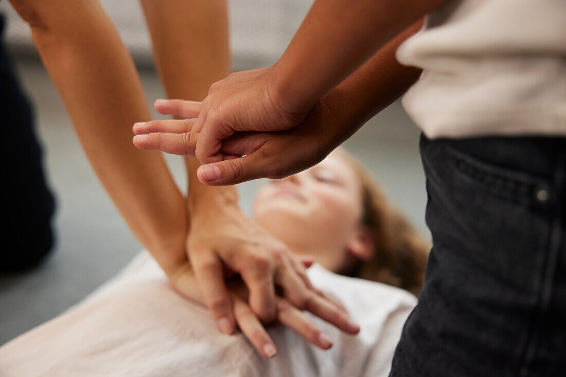 Teacher giving first aid training