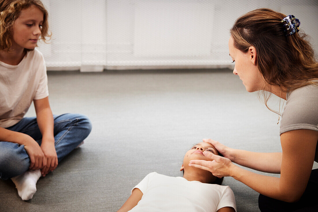 Teacher giving first aid training