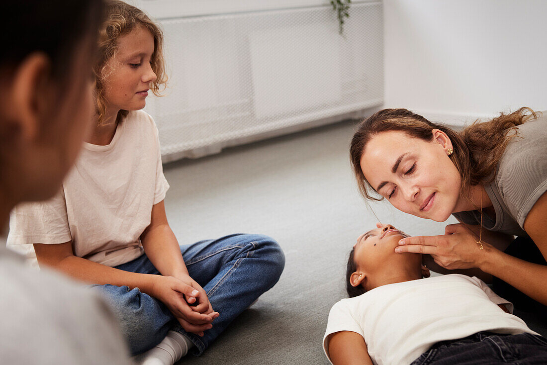 Teacher giving first aid training