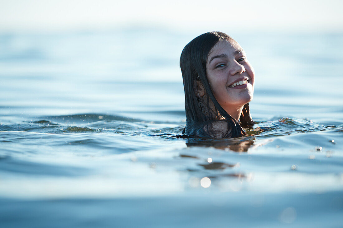 Teenage girl swimming in sea