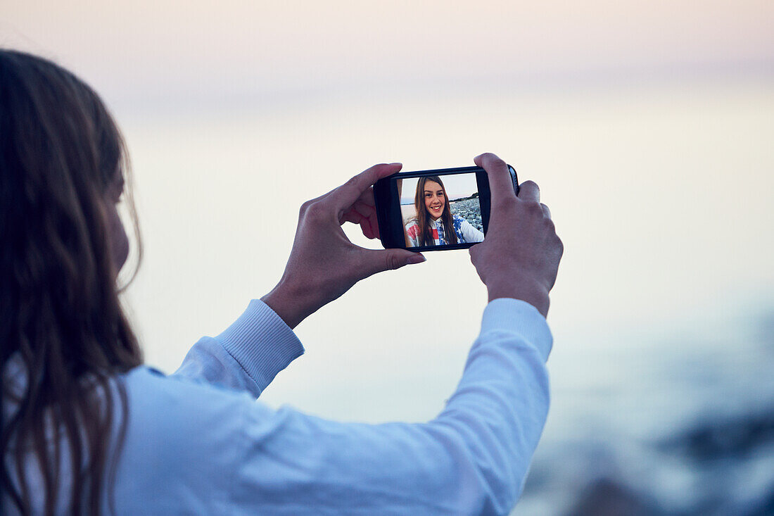 Teenage girl taking selfie