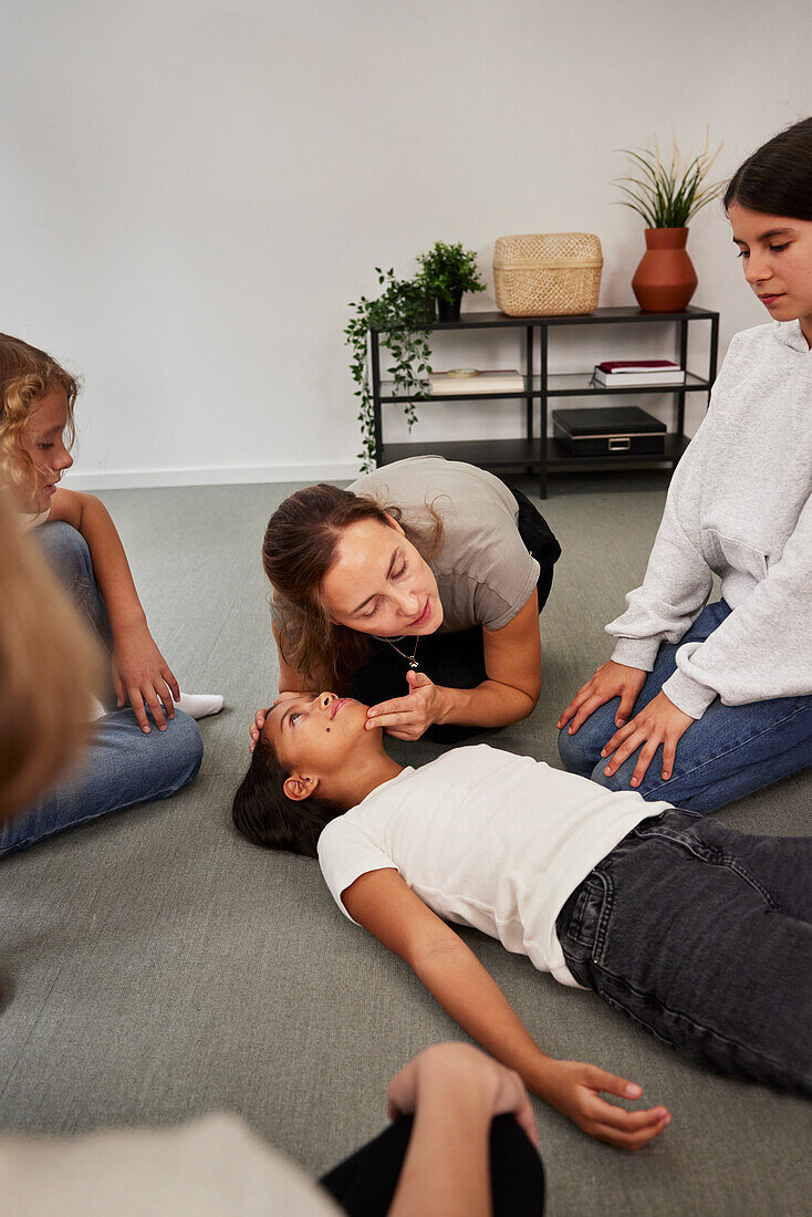 Teacher giving first aid training