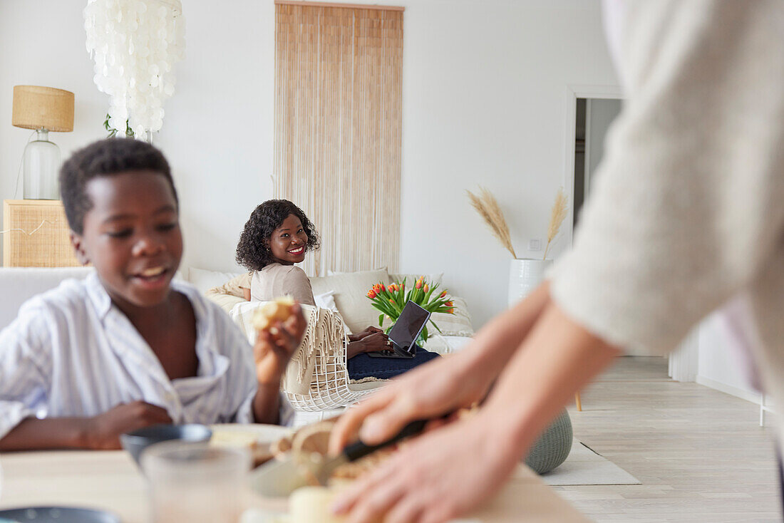 Family working and having meal at home