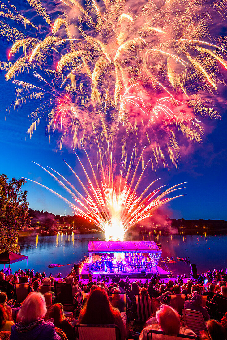 People watching firework display