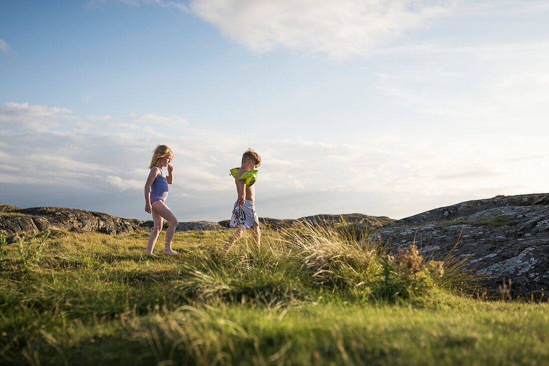 Children on rocky coast