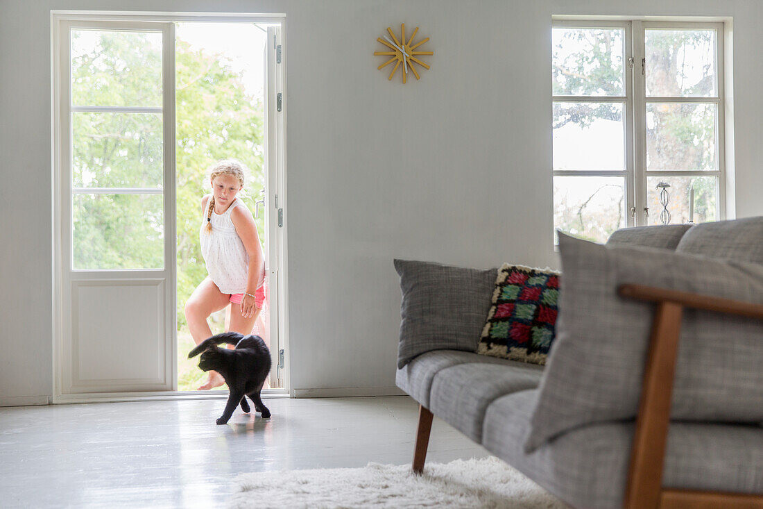 Girl entering living room