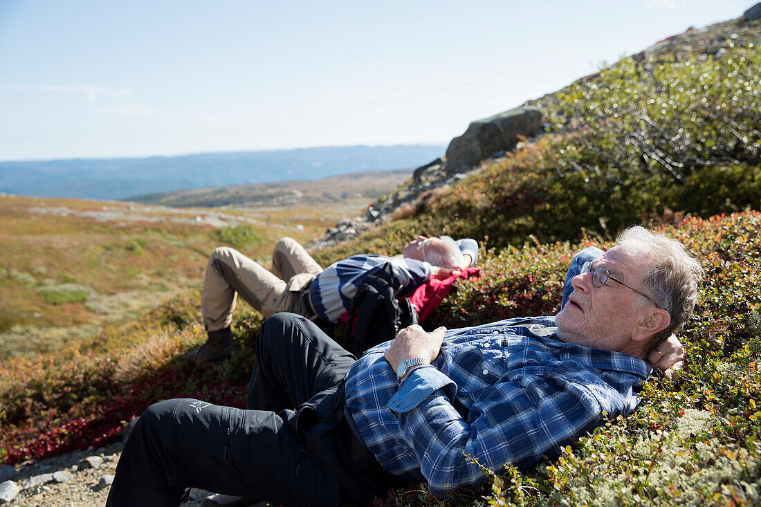 Senior hikers resting