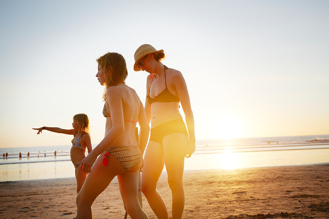 Mother with daughters on beach