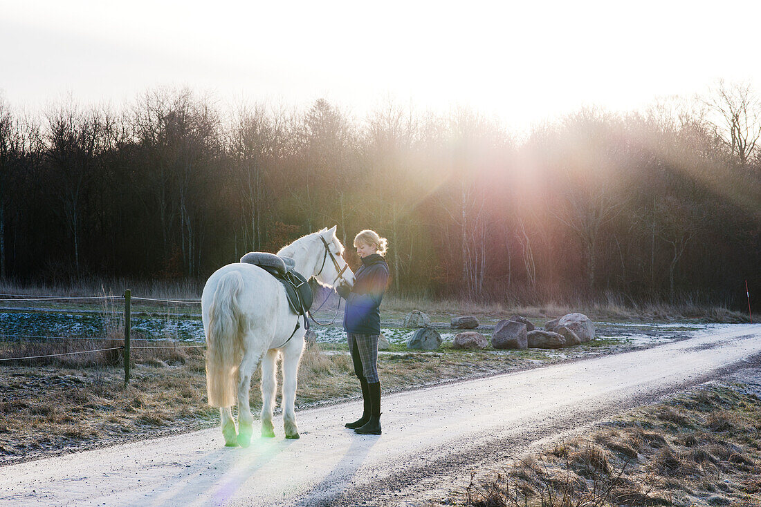 Woman with horse outdoor