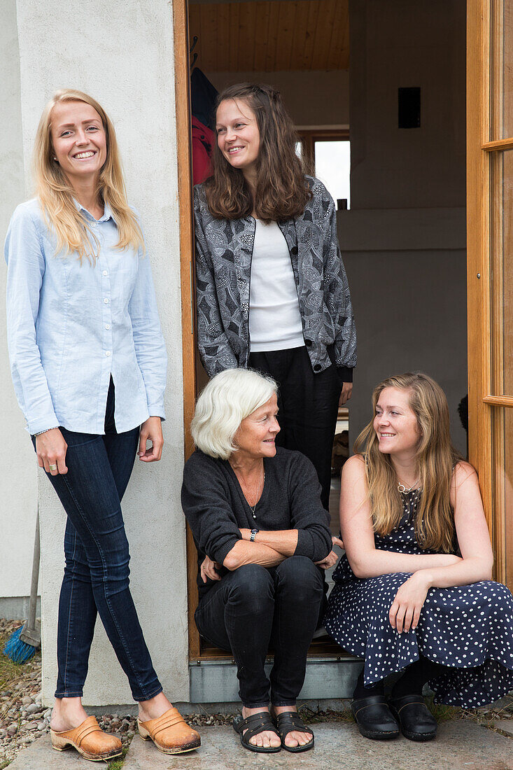 Senior woman with three adult granddaughters