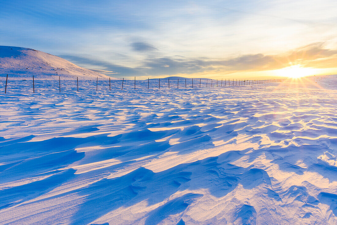 Winter landscape at sunrise