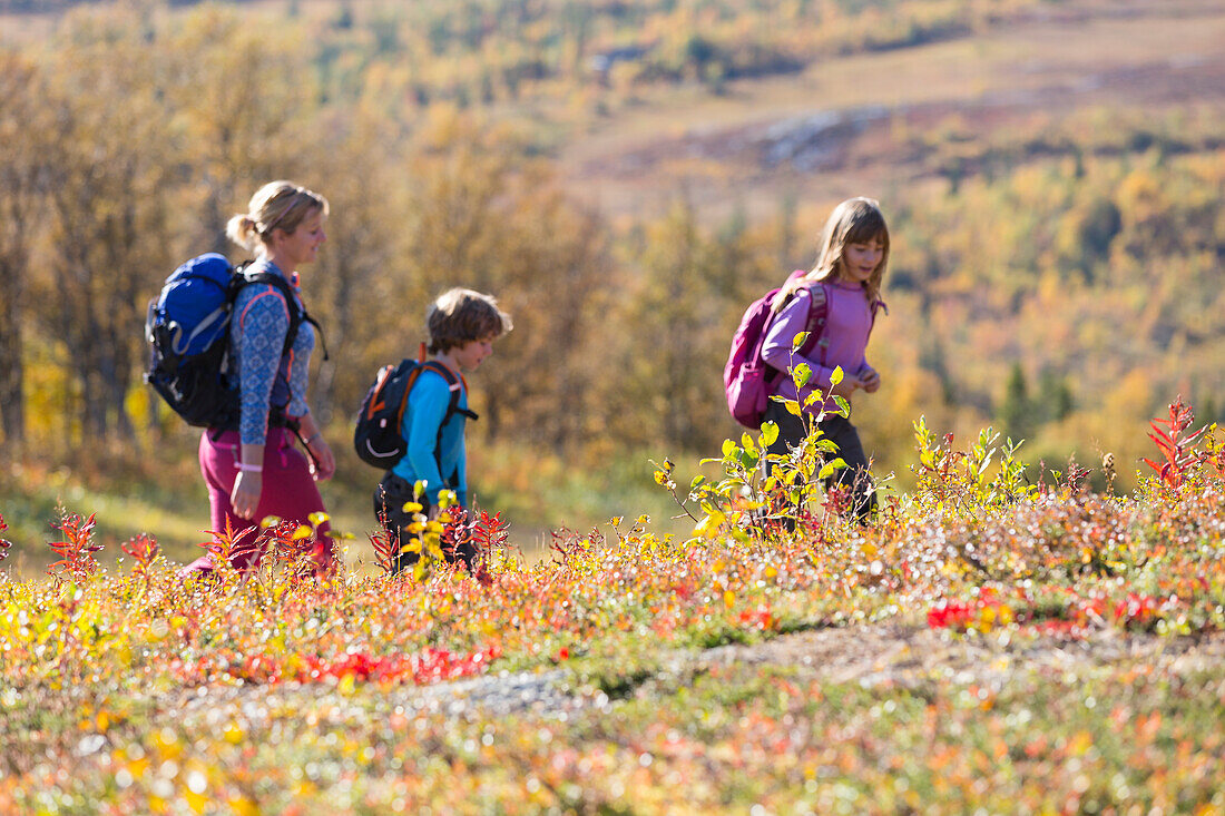 Mother hiking with children