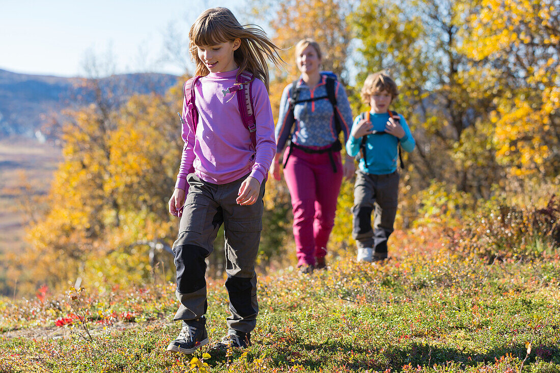 Mother hiking with children