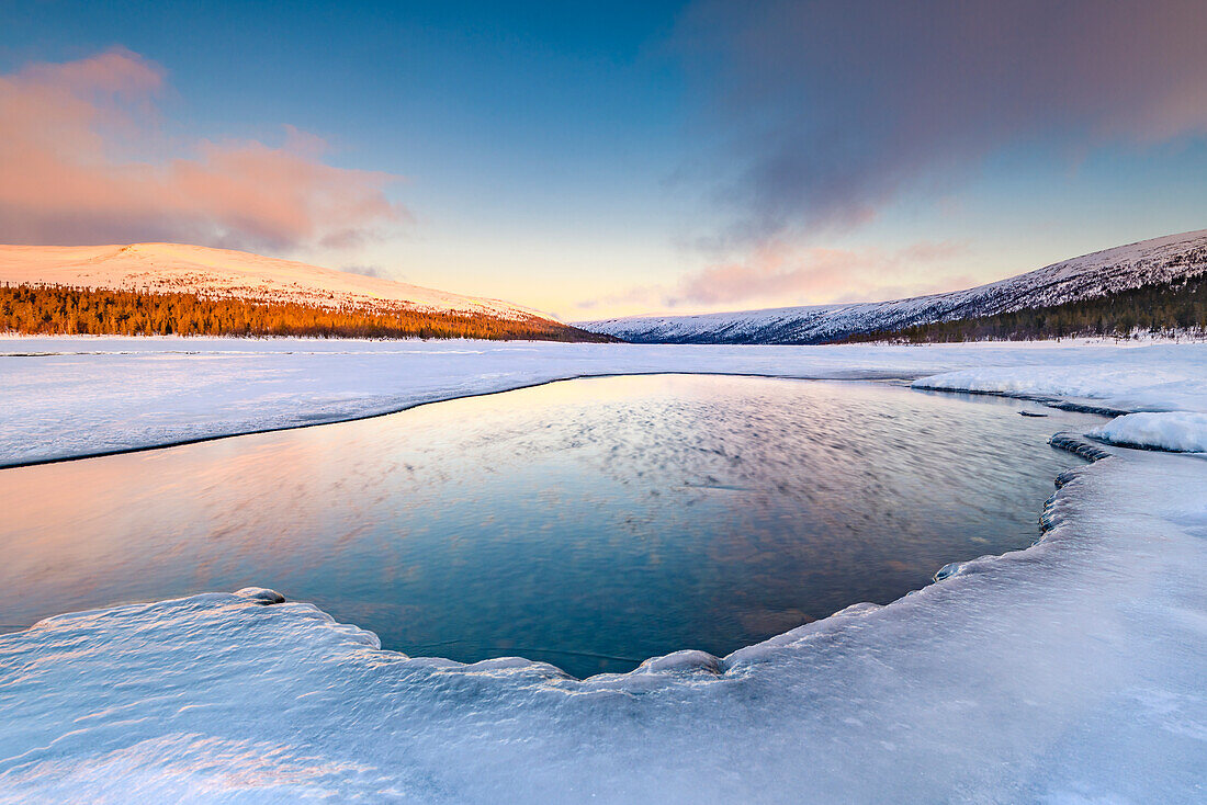 Winter landscape at sunrise