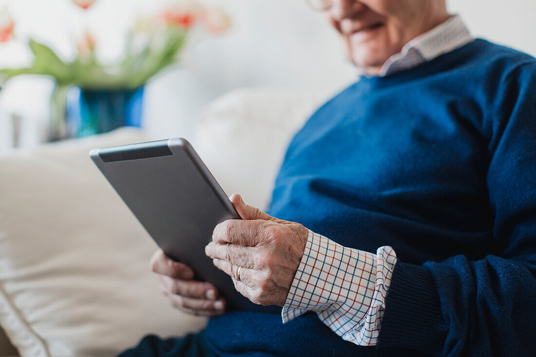 Senior man using digital tablet