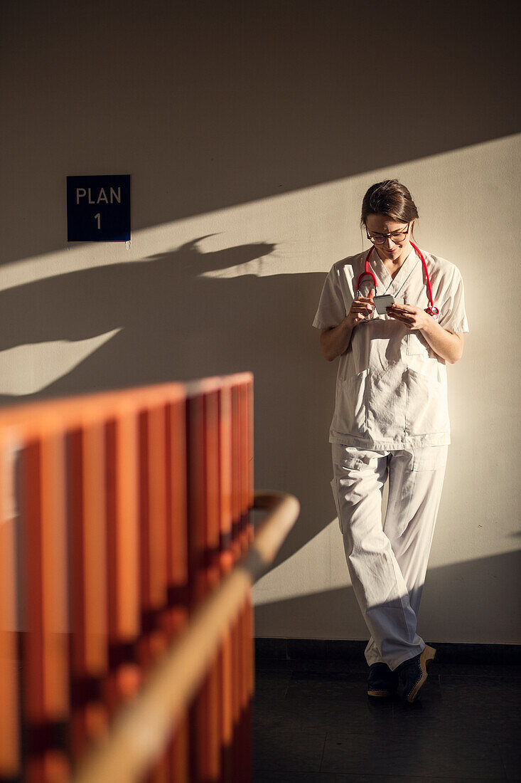 Female doctor using smartphone