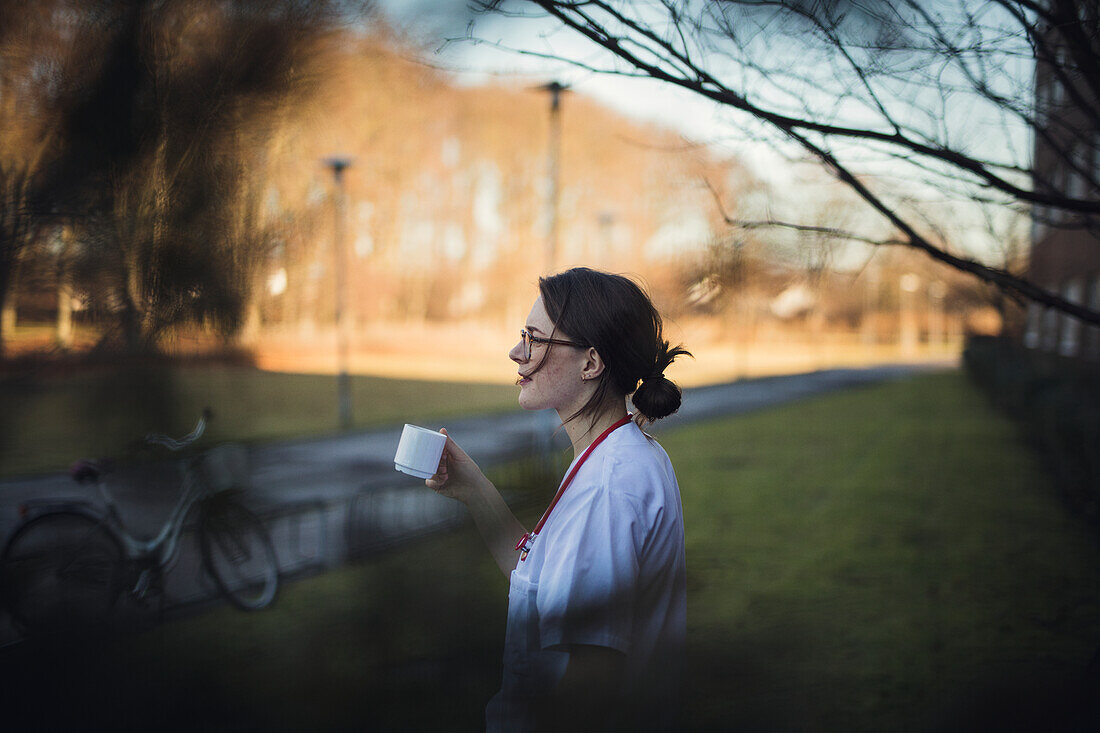 Female doctor enjoying coffee