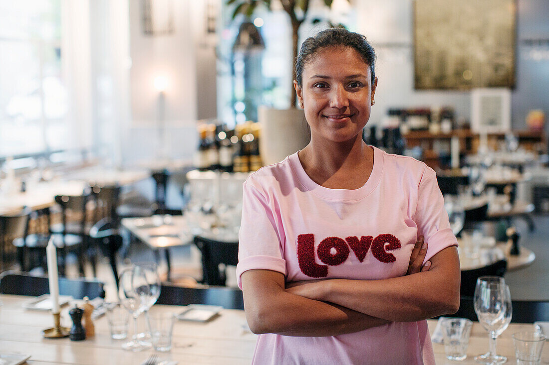 Smiling woman in restaurant