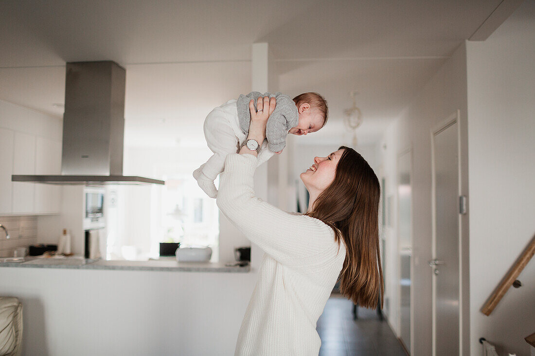 Mother playing with baby