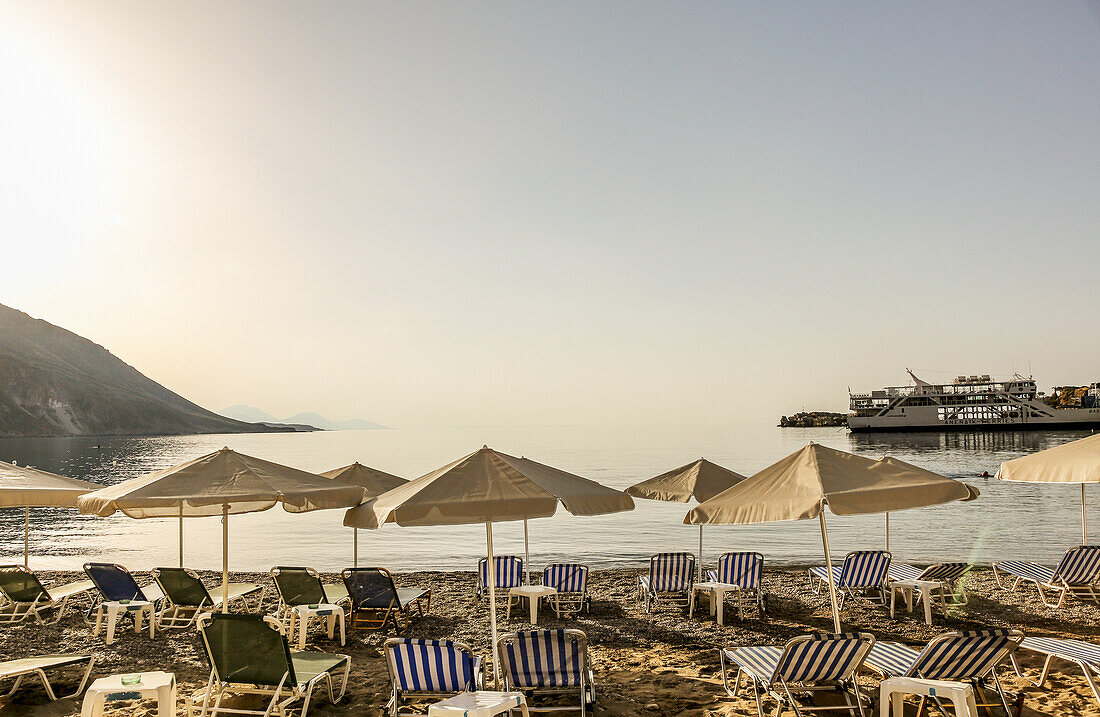 Sunshades with sun chairs on beach