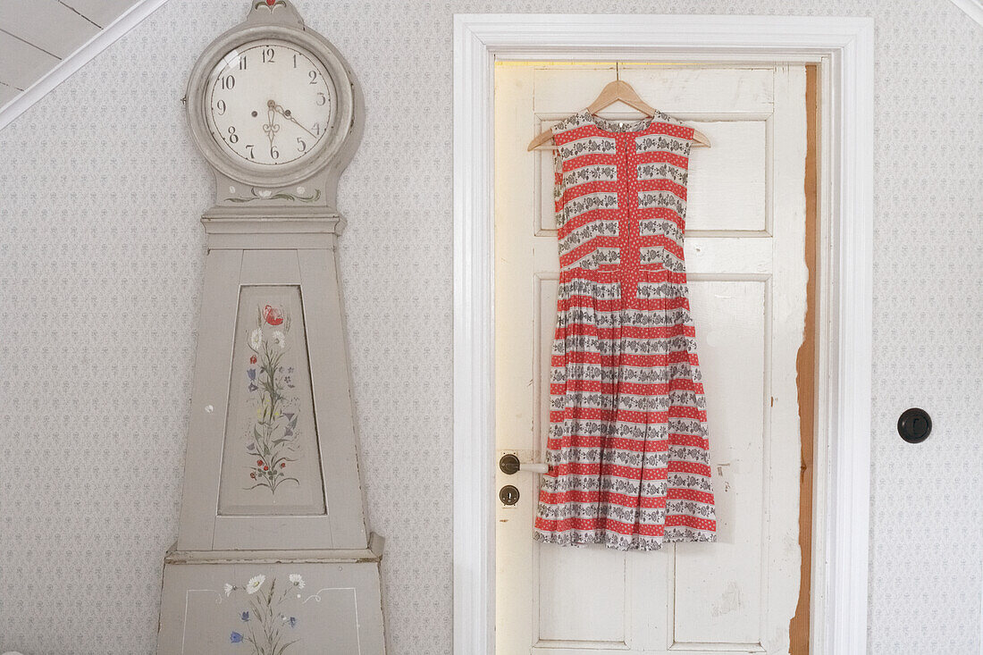 Girl dress hanging on door