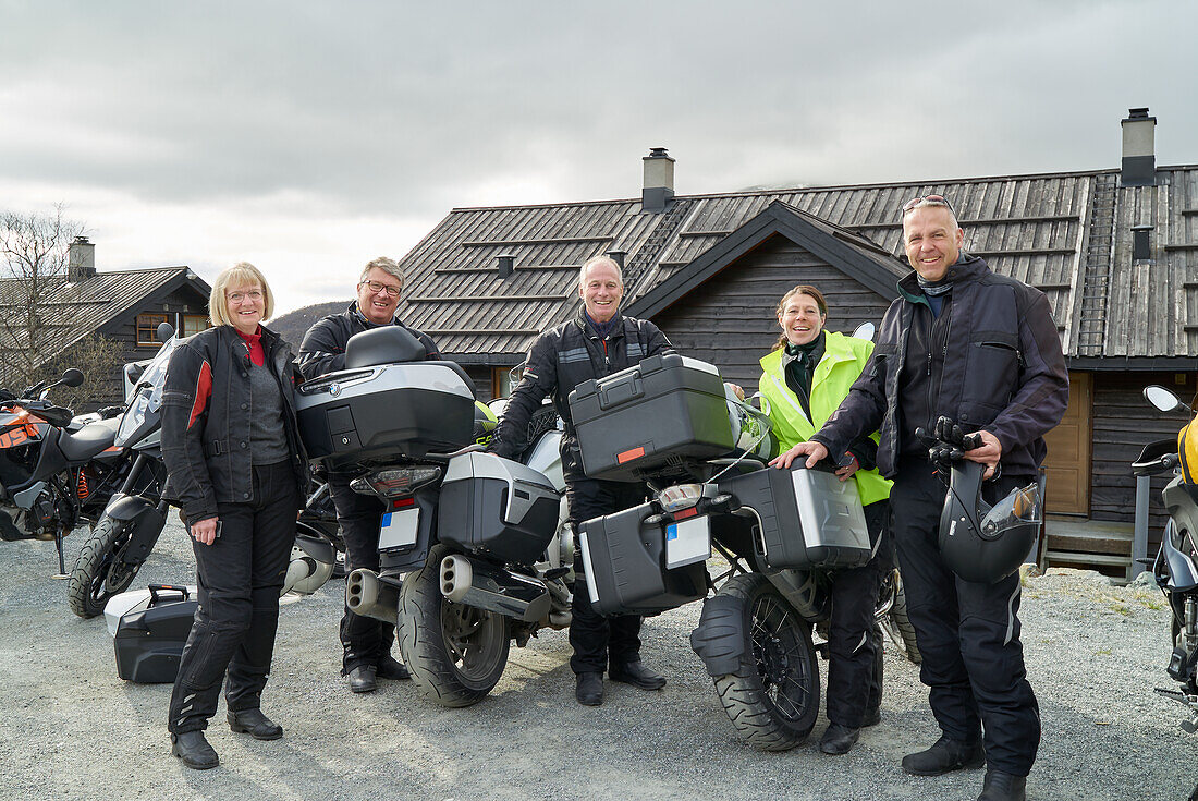 Smiling bikers looking at camera