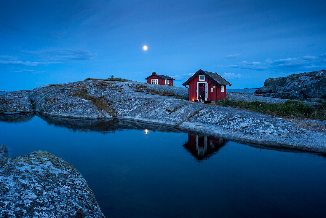 Wooden house on rocky coast