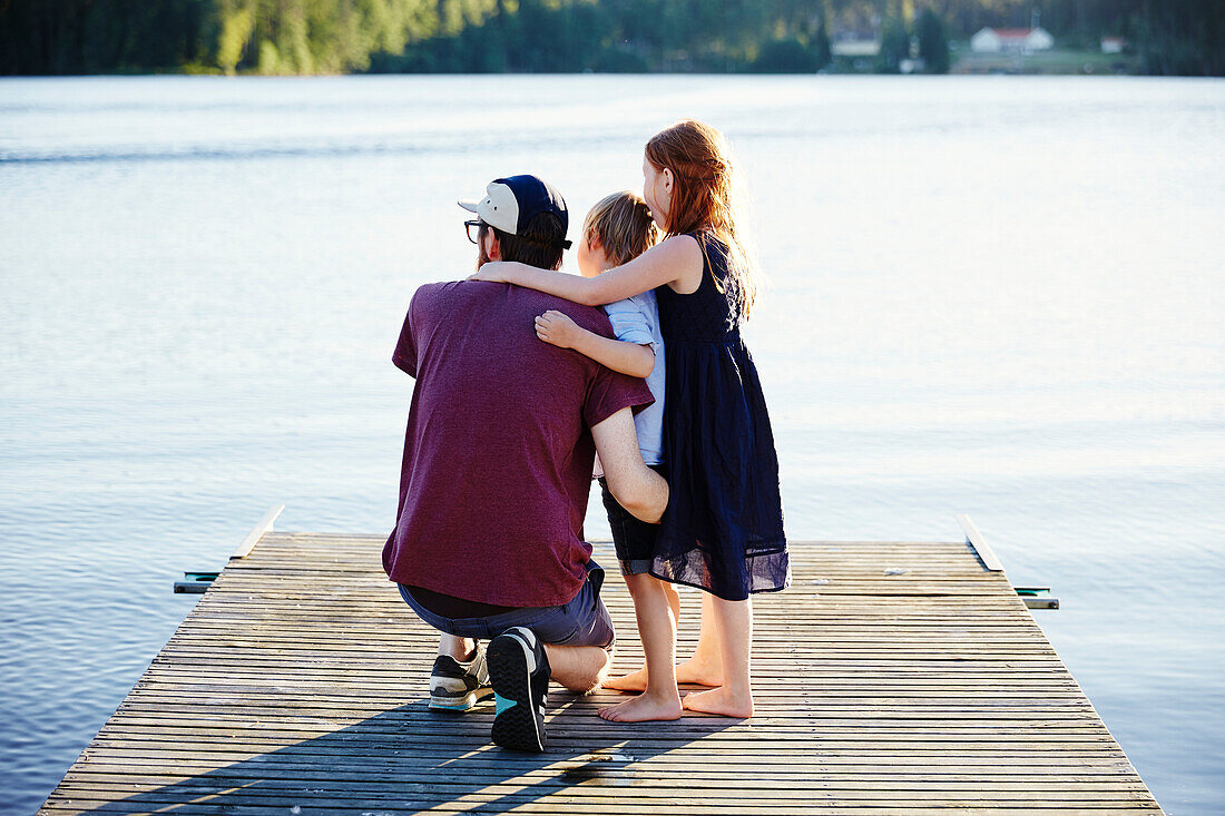 Children standing on pier