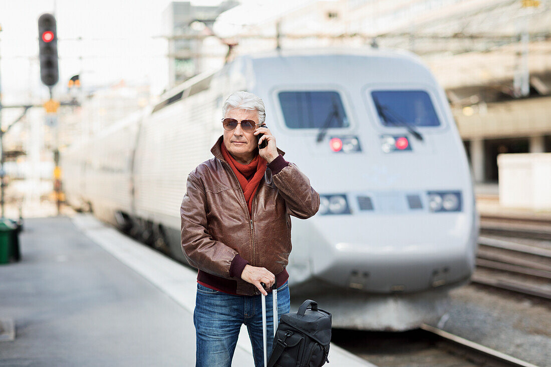 Mature man on train station