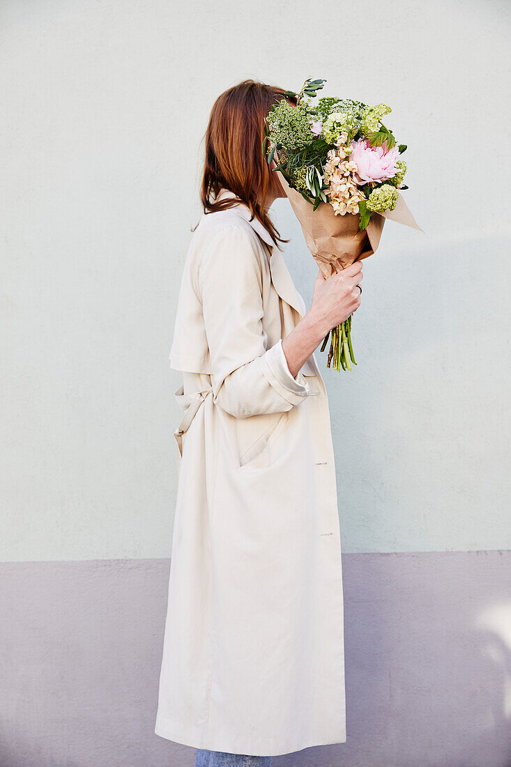 Woman holding bouquet of flowers