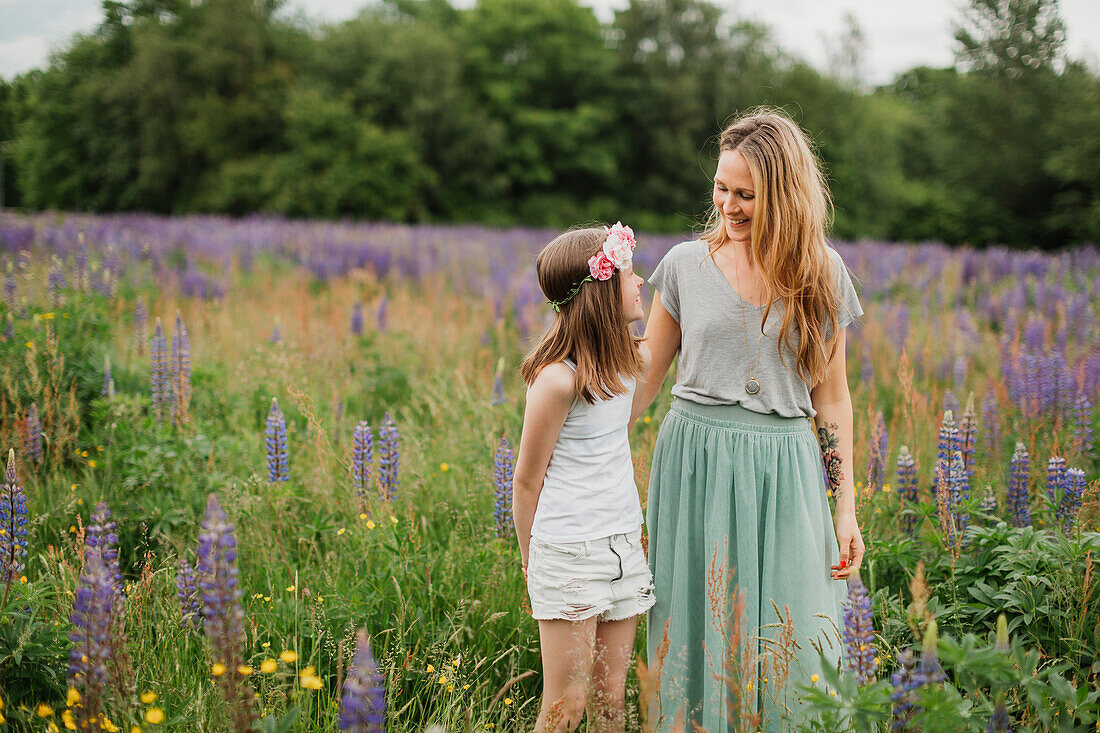 Mother and daughter on meadow