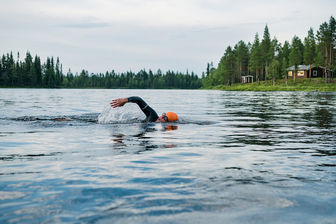 Person swimming in lake