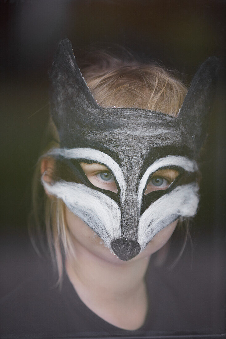 Portrait of girl wearing animal mask