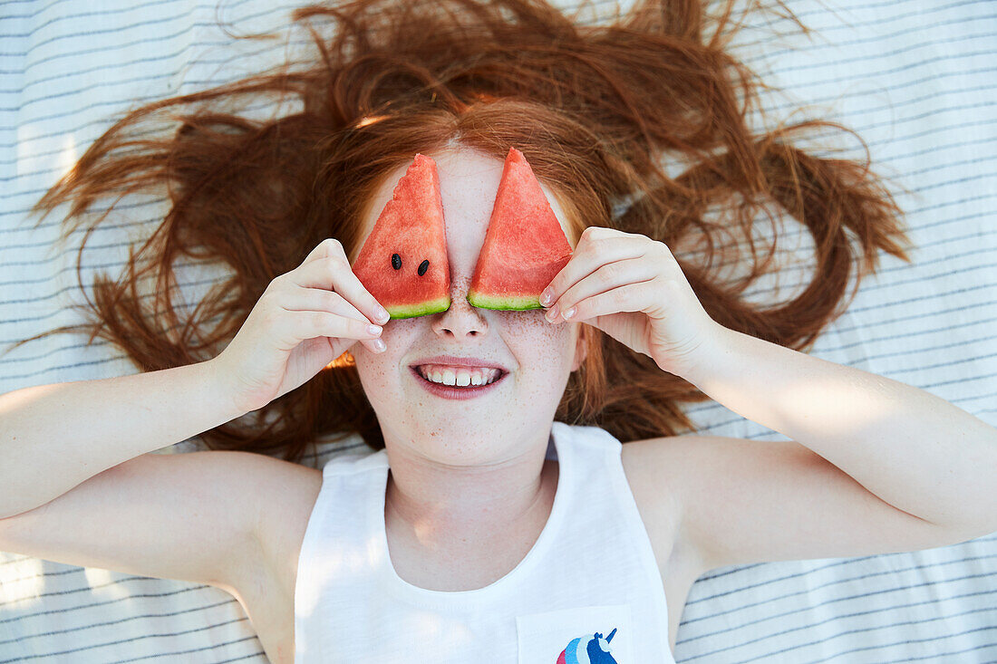 Girl and slices of water melon